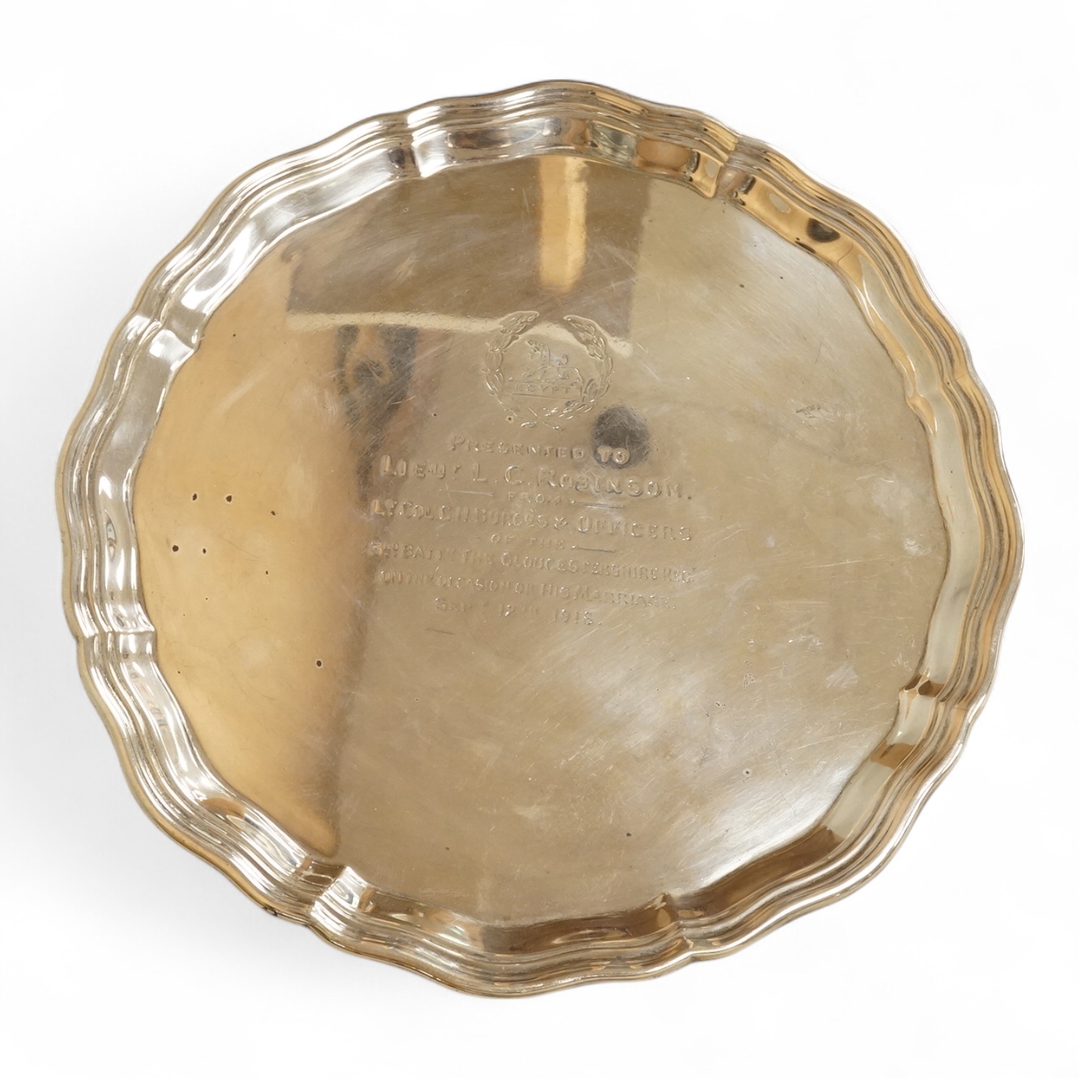 A George V silver salver, by Albert Faulkner, Sheffield, 1917, with engraved military related inscription, on three scroll feet, 25.9cm, 20.6oz.